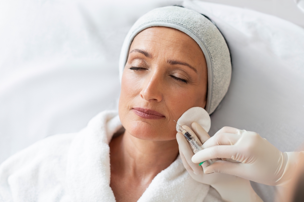 Middle,Aged,Woman,,Wearing,Medical,Cap,On,Head,,Receiving,Aesthetic